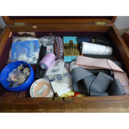 798 - An oak rectangular cutlery box with lift out shelf containing sewing implements, a bag of buttons, c... 