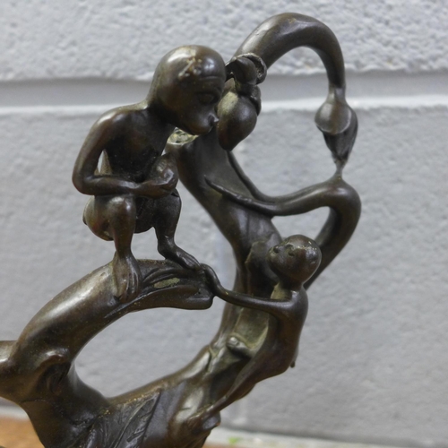 802 - A bronze sculpture depicting monkeys in a tree, 26cm