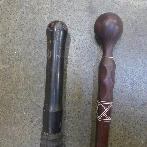 819 - Two carved wooden walking sticks converted from clubs