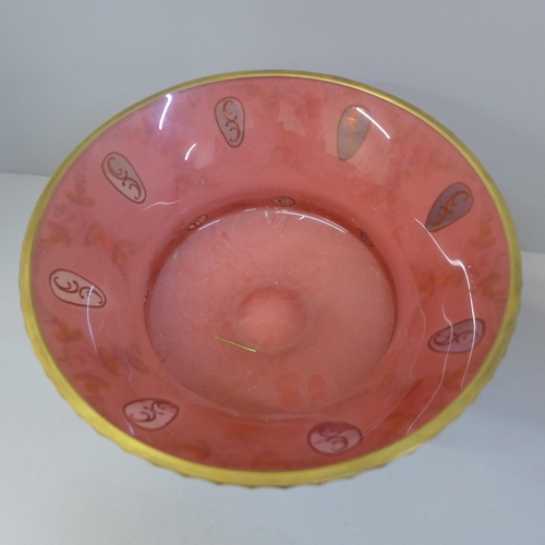 828 - An opaline overlay cranberry glass footed bowl, 17.5cm