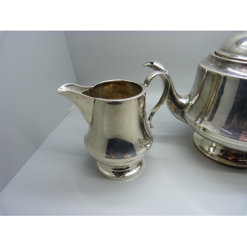 835 - A three piece silver tea service, Birmingham 1938,  by Dennison, 583g