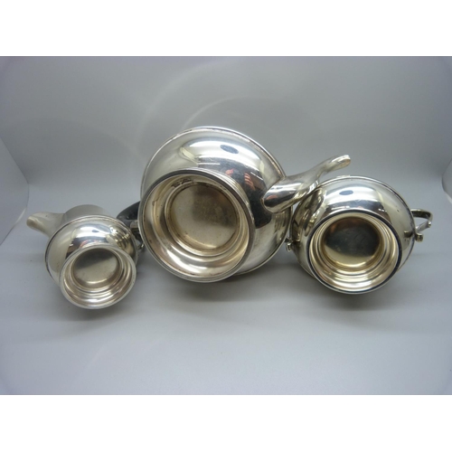 835 - A three piece silver tea service, Birmingham 1938,  by Dennison, 583g