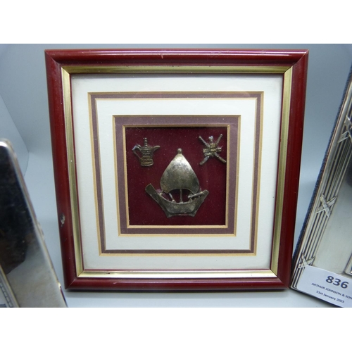 836 - A silver photograph frame, 20.5cm x 25.5cm, a silver framed clock and three small white metal easter... 