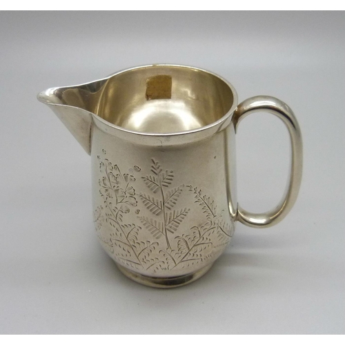 838 - A small Victorian silver jug, London 1888, by George Unite, 69g