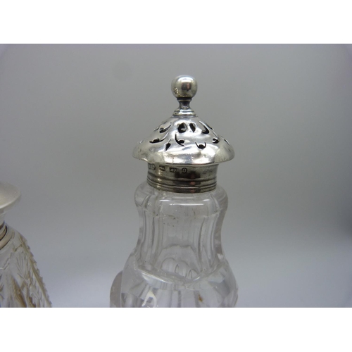 844 - Two silver topped glass shakers, one top a/f