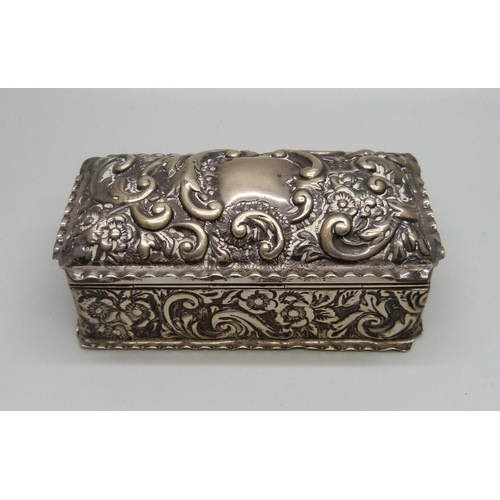 847 - A Victorian rectangular embossed silver box, 81g, 94mm wide, a/f