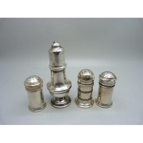 870 - Three silver pepper pots and a silver salt pot, 78g