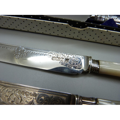 879 - Two silver and mother of pearl cake knives, Sheffield 1886 and 1921 and one other with silver handle... 