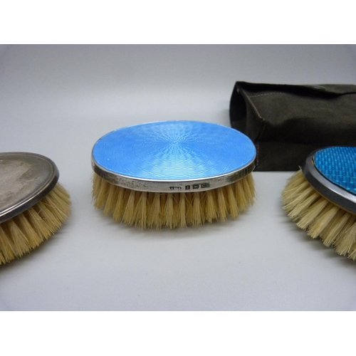 880 - An Art Deco silver and enamel clothes brush and two similar