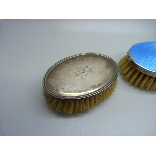 880 - An Art Deco silver and enamel clothes brush and two similar