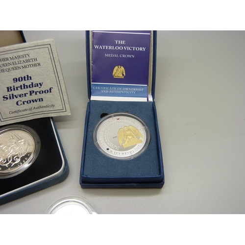 888 - A The Royal Mint 90th Birthday silver proof crown, a Waterloo Victory Medal crown and a Tercentenary... 