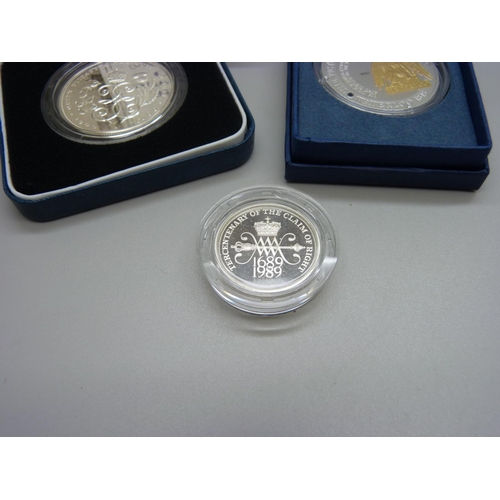 888 - A The Royal Mint 90th Birthday silver proof crown, a Waterloo Victory Medal crown and a Tercentenary... 