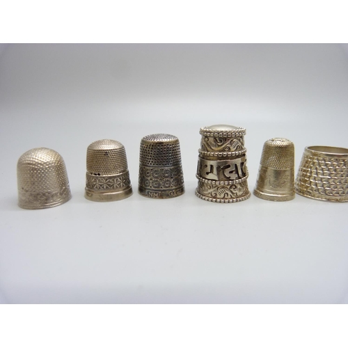 892 - Ten silver thimbles and one other