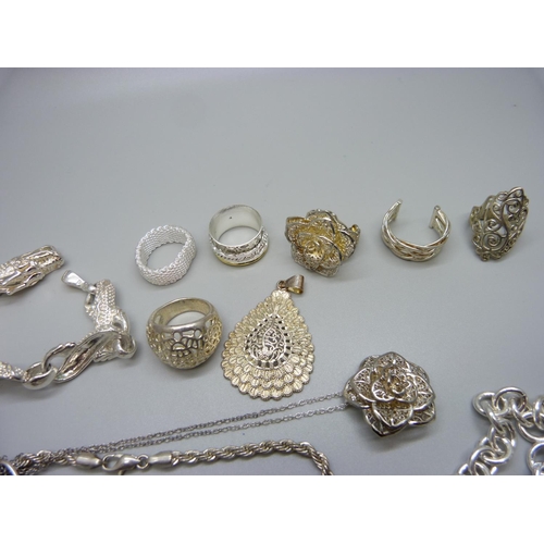 915 - A dragon bracelet and a neck chain, both marked 925, and other silver tone jewellery