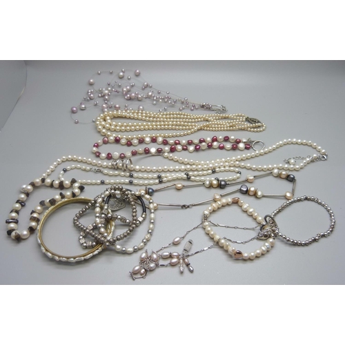 926 - A collection of cultured pearl, seven necklaces and five bracelets, necklaces with silver clasps