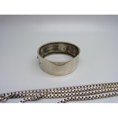 933 - A vintage silver bangle, marked 925, and long guard chain