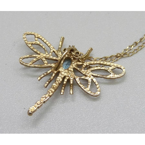 952 - A 9ct gold dragonfly pendant set with a blue stone, on a fine 9ct gold chain, 1.9g