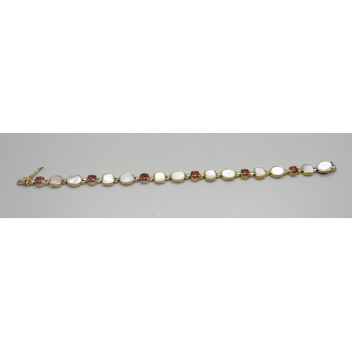 956 - A silver gilt, mother of pearl and red stone bracelet