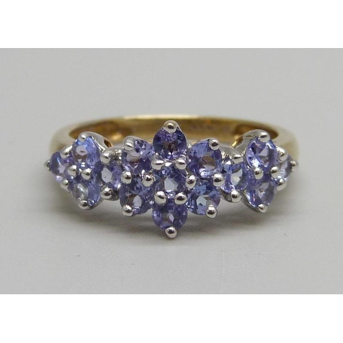 964 - A 9ct gold, triple cluster tanzanite ring, 2g, M