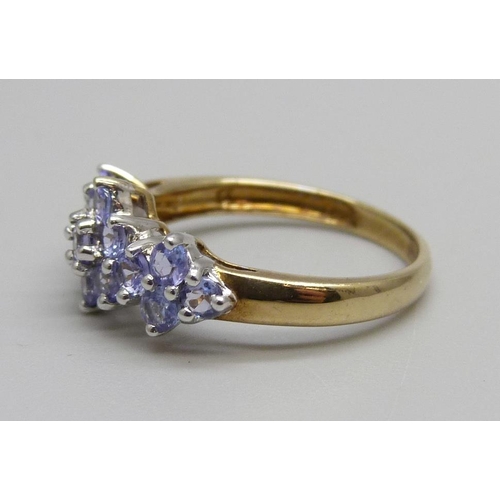 964 - A 9ct gold, triple cluster tanzanite ring, 2g, M