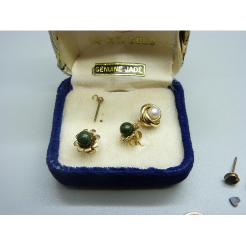 989 - A pair of 14k gold and jade stud earrings, etc.