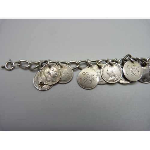 990 - A silver nineteen coin bracelet, 34g