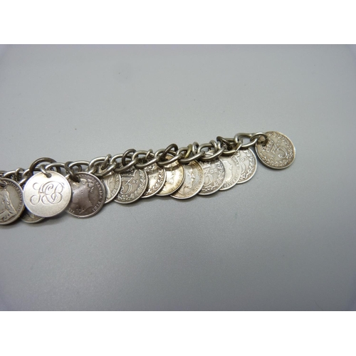 990 - A silver nineteen coin bracelet, 34g