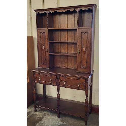 183 - A 17th Century style oak geometric moulded dresser