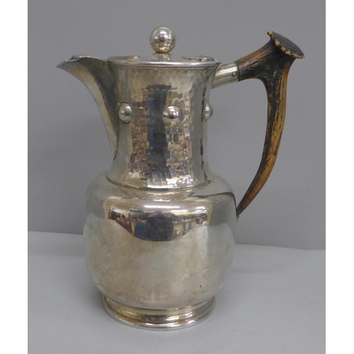 601 - An Arts and Crafts plated jug with antler handle