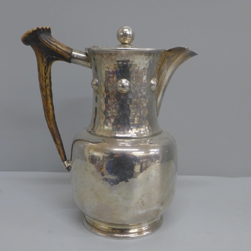 601 - An Arts and Crafts plated jug with antler handle