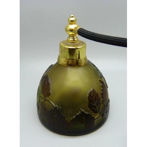 627 - A cameo glass perfume atomiser decorated with flowers and leaves