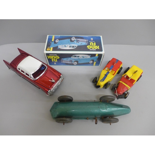 630 - Two slot racing cars, a clockwork racing car and a boxed Xing Fu Sedan model car