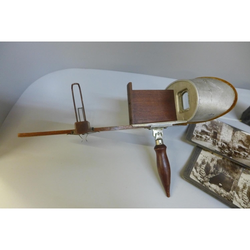 667 - A Stereoscope viewer and twelve cards