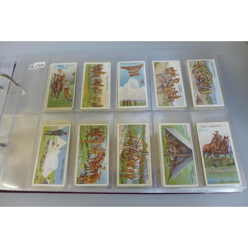 676 - Cigarette cards; an album of eleven sets of Players cigarette cards