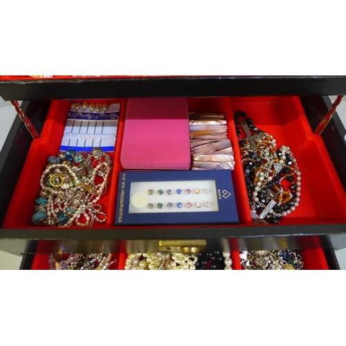 690 - A jewellery box and costume jewellery including silver