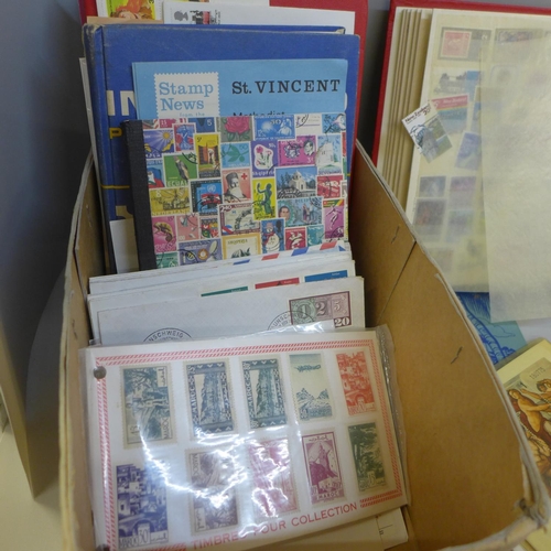 704 - Stamps; a box of stamps in nine medium and small stock books and covers