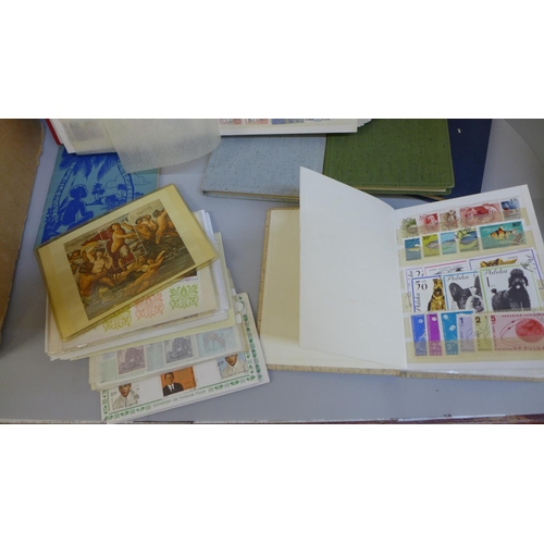 704 - Stamps; a box of stamps in nine medium and small stock books and covers