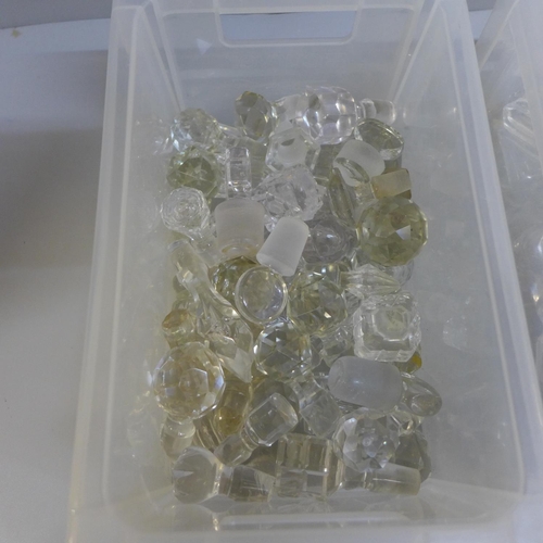 711 - Two boxes of mainly cut glass, various shaped and sized bottle stoppers, many imperfect (110)