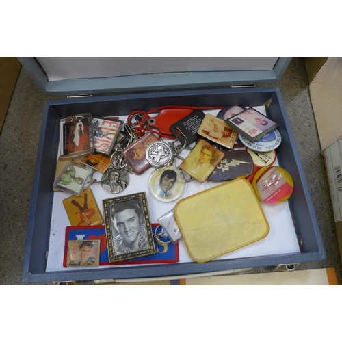 733 - Two boxes of Elvis Presley ephemera, records and CDs, badges, etc.