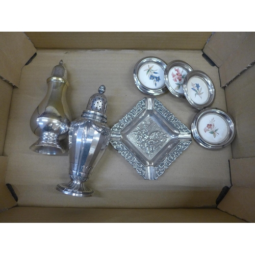 738 - A collection of silver plate items including candlesticks, sugar sifters, a set of wine coasters, ce... 