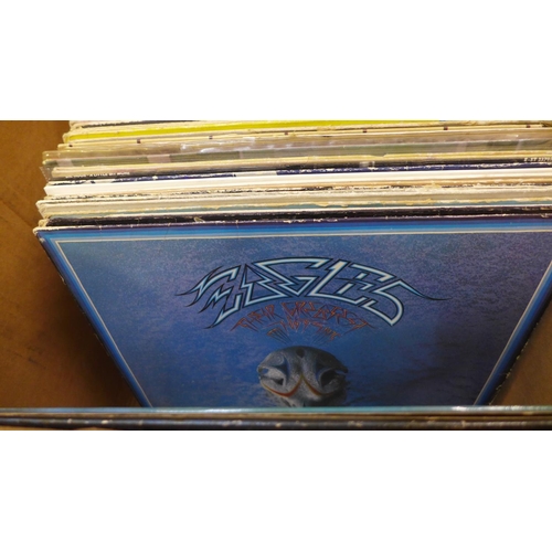 749 - A collection of over 50 LP records from 1970s and 1980s including Madness, The Police, Tom Petty, Wi... 