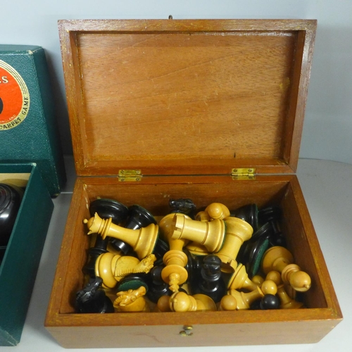 782 - A full set of turned wooden chess pieces (height of King 8cm) and a set of carpet bowls