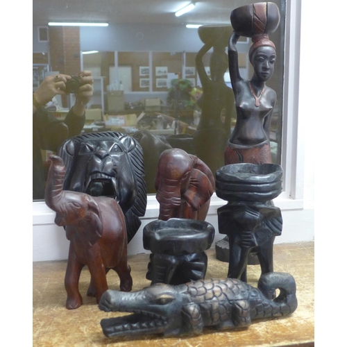 800 - A collection of carved African wooden figures including elephants, a lady, a crocodile, etc.