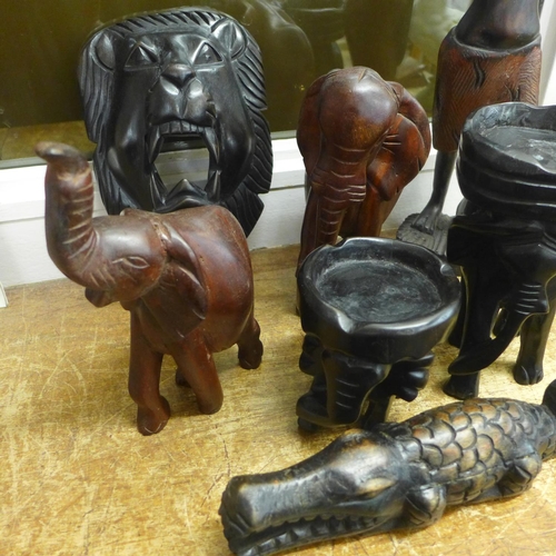 800 - A collection of carved African wooden figures including elephants, a lady, a crocodile, etc.