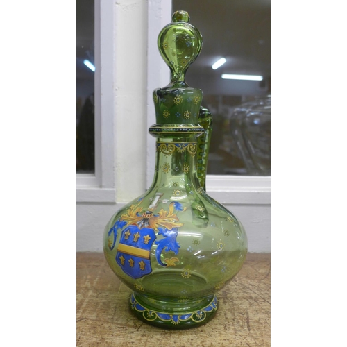 802 - A Bohemian green glass claret jug with enamelled coat of arms