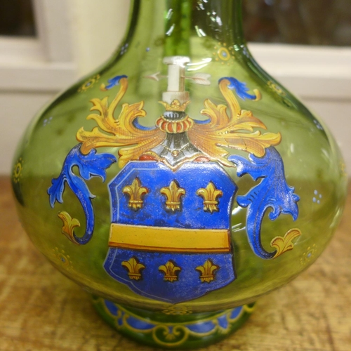 802 - A Bohemian green glass claret jug with enamelled coat of arms