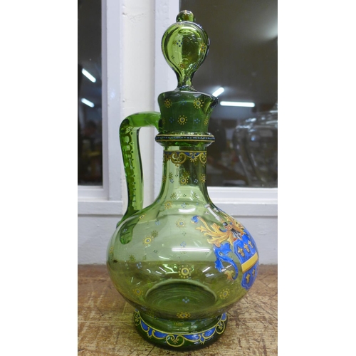 802 - A Bohemian green glass claret jug with enamelled coat of arms