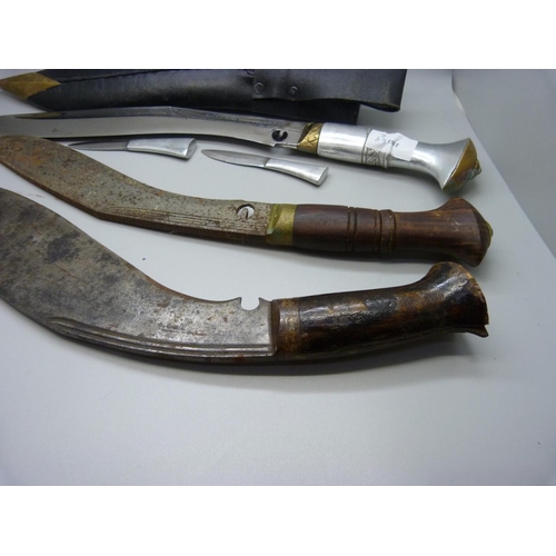 845 - A kukri and two others lacking scabbards