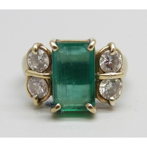 928 - An 18ct gold, emerald and diamond ring, 7.1g, M, emerald 7mm x 11mm