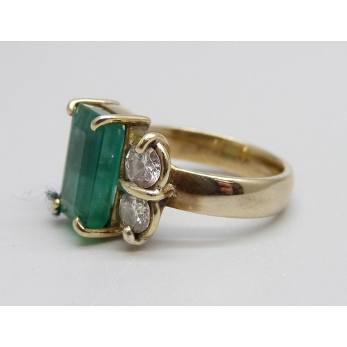 928 - An 18ct gold, emerald and diamond ring, 7.1g, M, emerald 7mm x 11mm